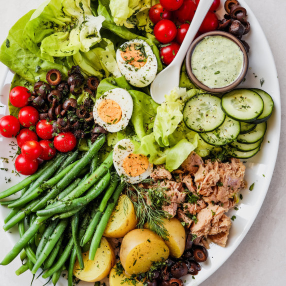nicoise salad on white platter