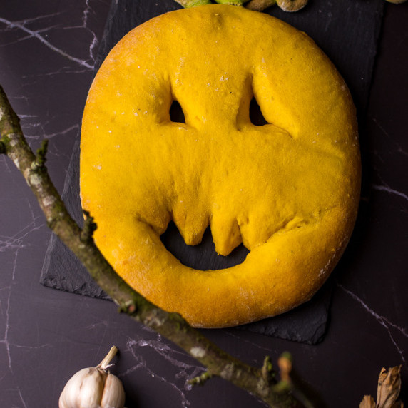 a pumpkin shaped fourgasse on black background. 