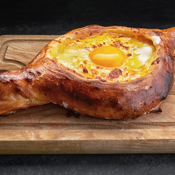 Adjaruli Khachapuri. Georgian bread with cheese and egg.