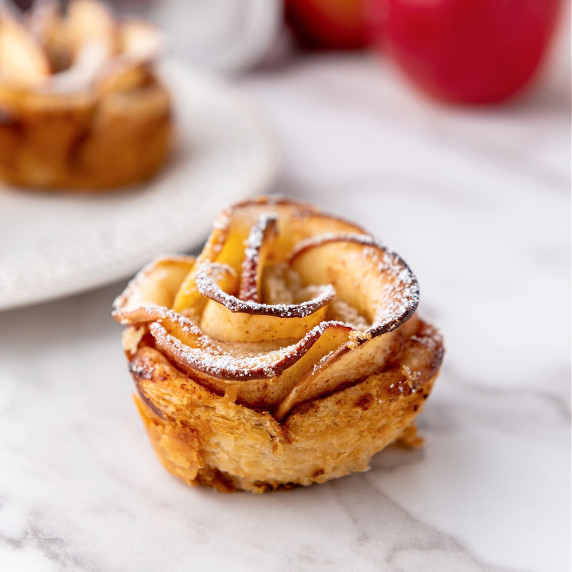 Apple rose made of apple slices and puff pastry.