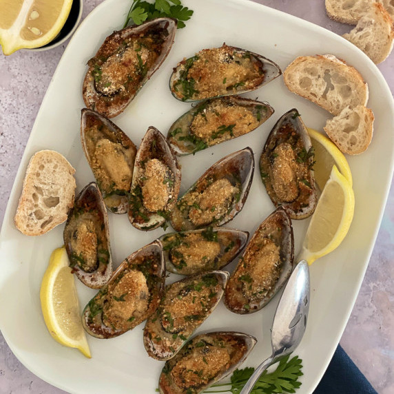 Mussel baked on a white plate