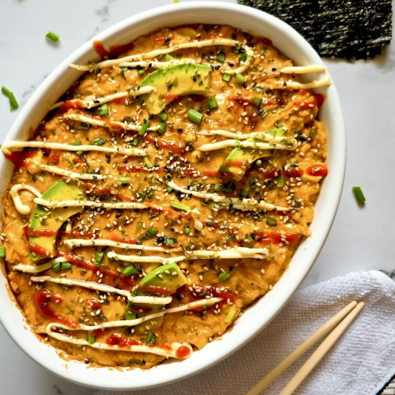 Salmon sushi bake in a large white baking dish.