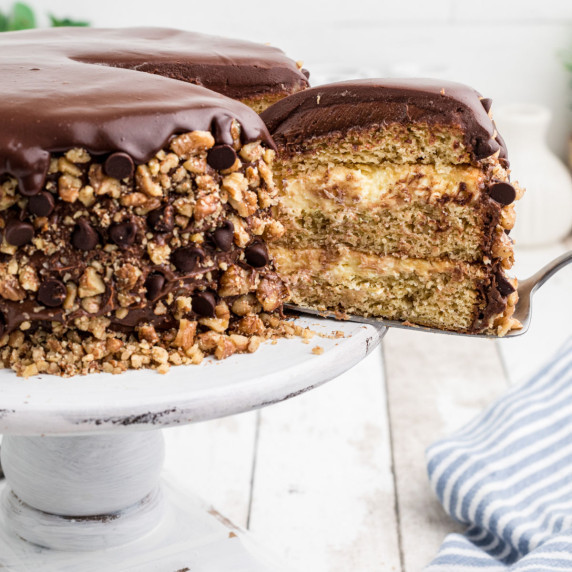 A slice of cake being removed from a banana dream cake.