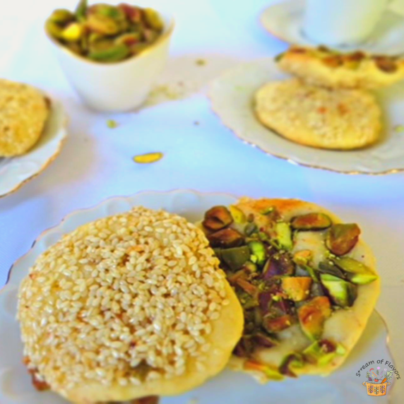 Bazarek cookies with toasted sesame seeds soaked in orange blossom sugar syrup and pistachios