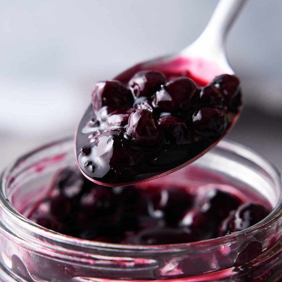 Blueberry compote on a spoon.