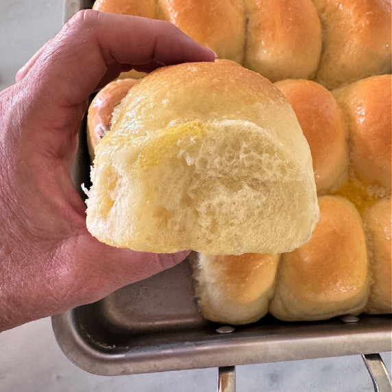 Pan of buttery dinner rolls.