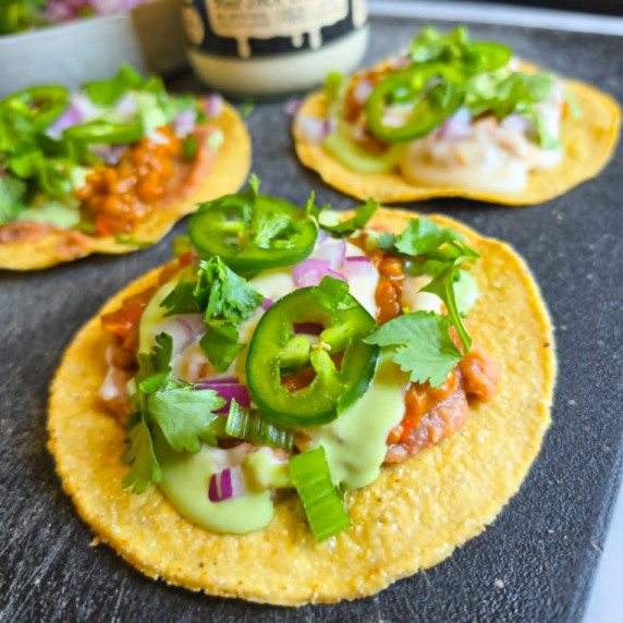 Golden tostadas topped with an assortment of colourful toppings