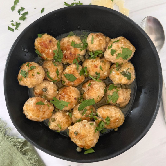 A pan of chicken piccata meatballs.