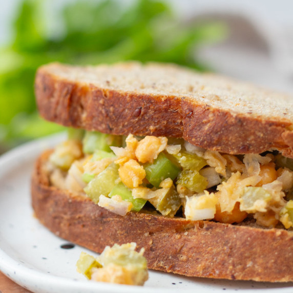 finished bowl of no-chicken chickpea salad on top of lettuce