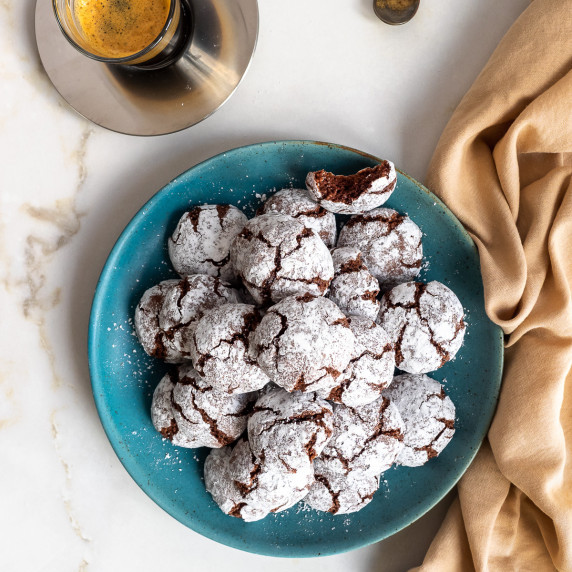 Plate of chocolate amaretti cookies served with an espresso.