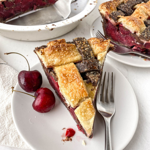 photo of slice of chocolate cherry pie on a white plate