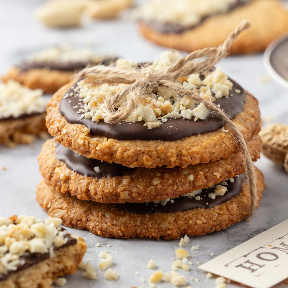 Stack of Crispy Chocolate-Dipped Oatmeal Peanut Cookies
