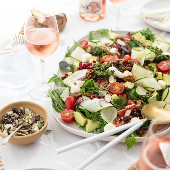 Large platter of colourful salad on a dinner table