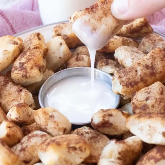 Cinnamon roll bites dipped in icing
