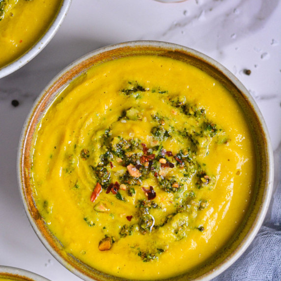 Butternut Squash Squash Soup with a Pistachios Gremolata Twist in a bowl
