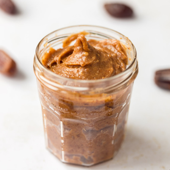 date caramel sauce in glass jar 