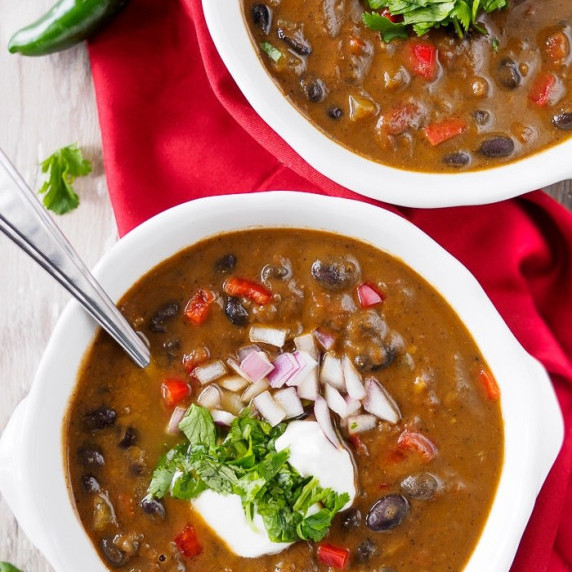 Two bowls of black bean soup.