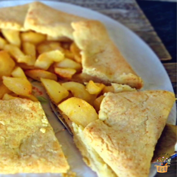 Easy Apple Galette on a white plate with a pie slicer