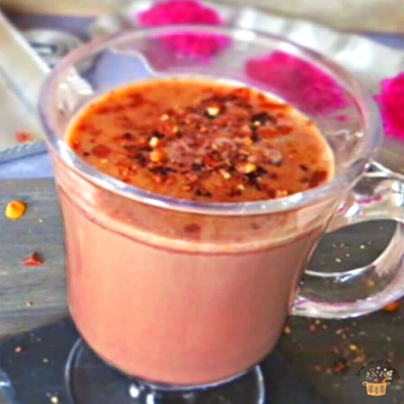Hot chocolate with condensed milk, ground hazelnuts, and cocoa powdered with hazelnuts and chocolate
