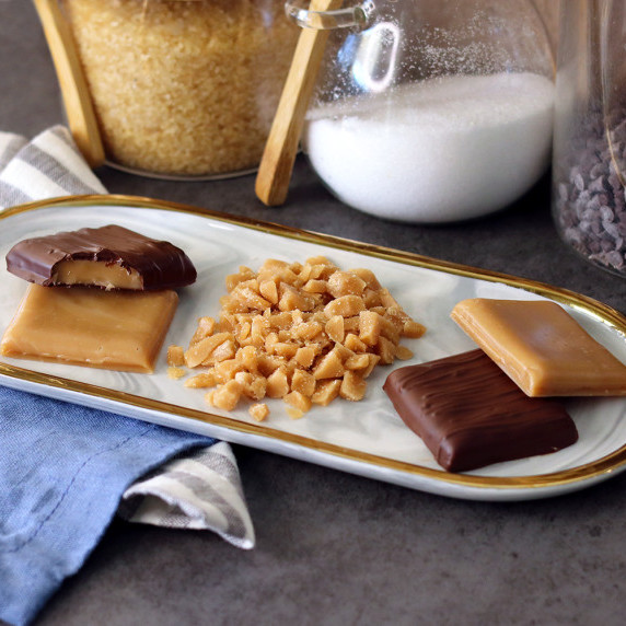 English toffee, plain, chocolate covered and crushed, on a small platter
