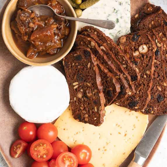 Close up of a cheese platter with cheeses and crackers