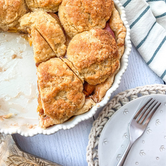 top view of sliced ginger peach biscuit pie