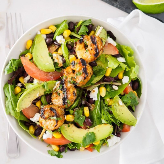 Plate of grilled shrimp salad.
