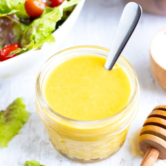 Honey Mustard Vinaigrette RECIPE served in a Mason jar.