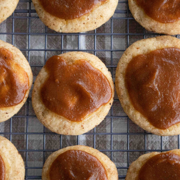 tray of snickerdoodles with pumpkin spice glaze