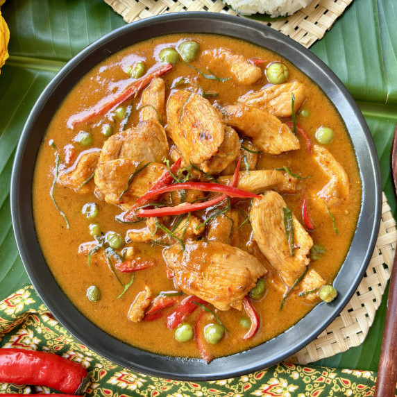 Thai chicken panang curry, gaeng panang gai, in a black bowl.