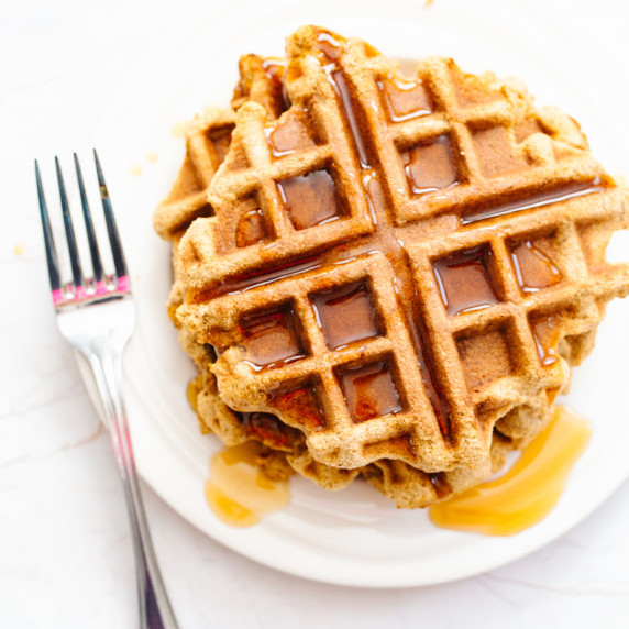 coconut flour waffles drizzled with pure maple syrup