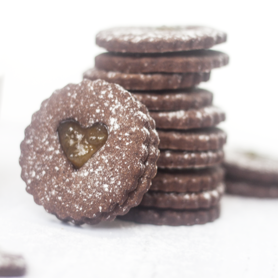 chocolate orange linzer cookies on white background