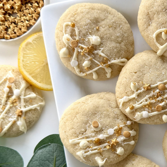 A plate of sparkling lemon sugar cookies is seen from above.  