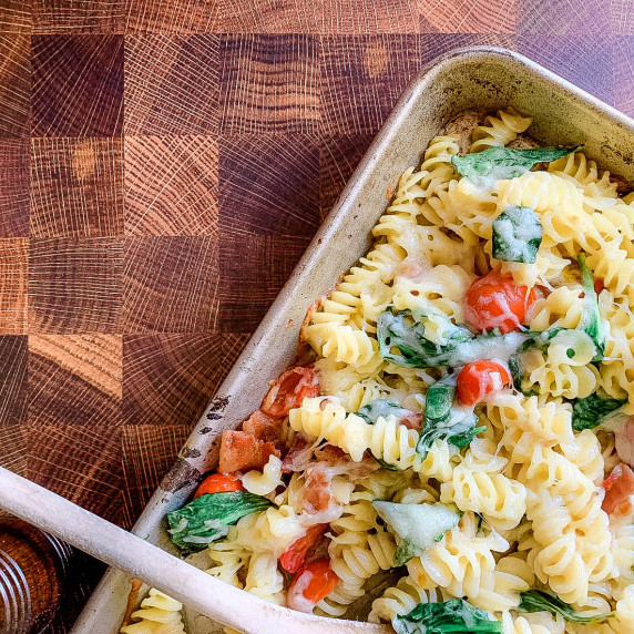a tray of pasta on butcher block