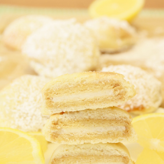 Lemon air fried Oreos on a yellow tablecloth.  