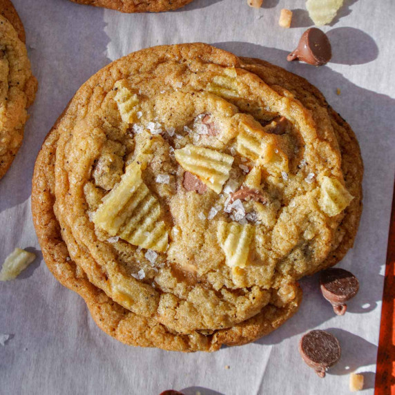 Baked kitchen sink cookie loaded with chocolate chips, potato chips, and toffee bits.