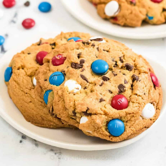 Cookies on a plate with red white and blue M&Ms.