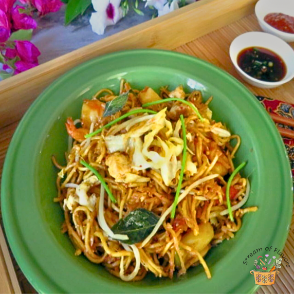 Mamak Mee Goreng with fresh yellow noodles, tofu, veggies, shrimp, bean sprouts, and kecap manis
