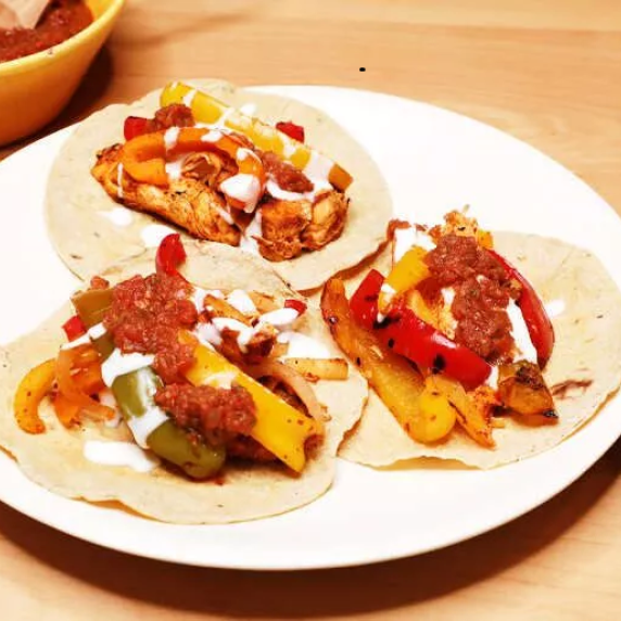 Chicken Fajitas served in white plate