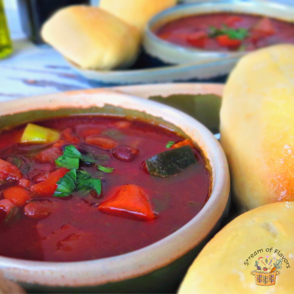 Minestrone Soup With Breadsticks veggies, beans, and pasta, with homemade breadsticks in a bowl