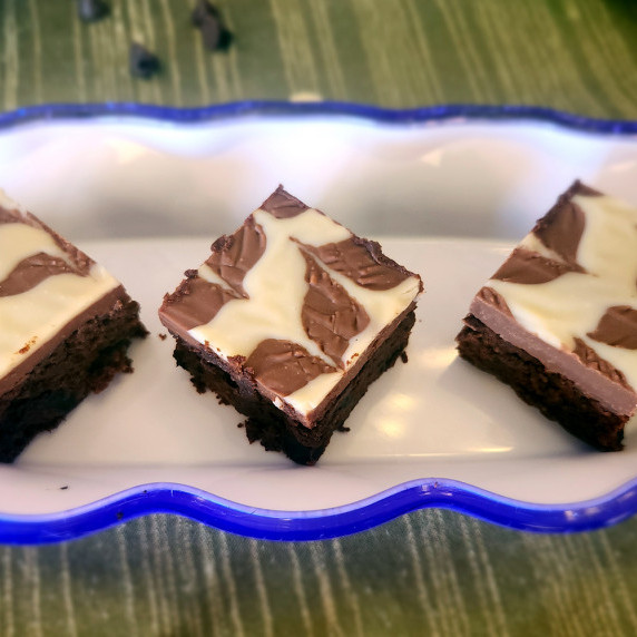 Mocha chocolate chunk brownies arranged on a serving dish.