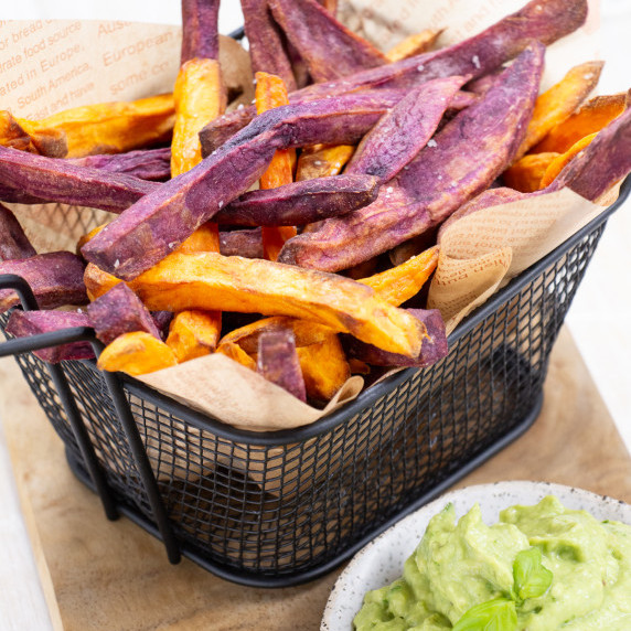 multicoloured sweet potato fries with an avocado dip