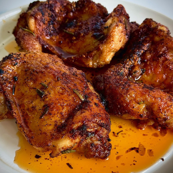 crispy chicken thighs on plate