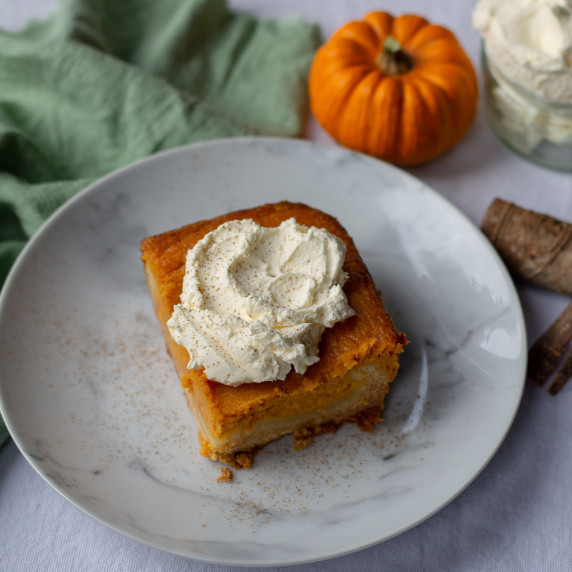 Pumpkin Spice Gooey Butter Cake on a marble plate