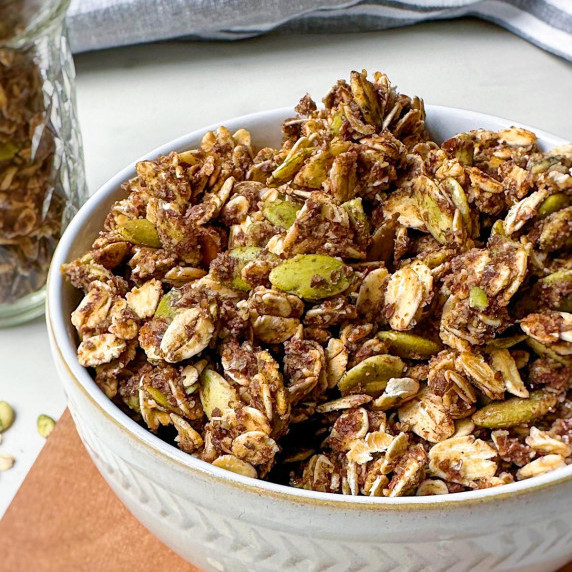 nut free pumpkin seed granola in a white bowl