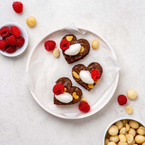 Raspberry heart-shaped brownies with macadamia nuts