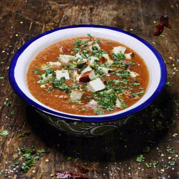 Salsa roja with Cotija cheese in a bowl