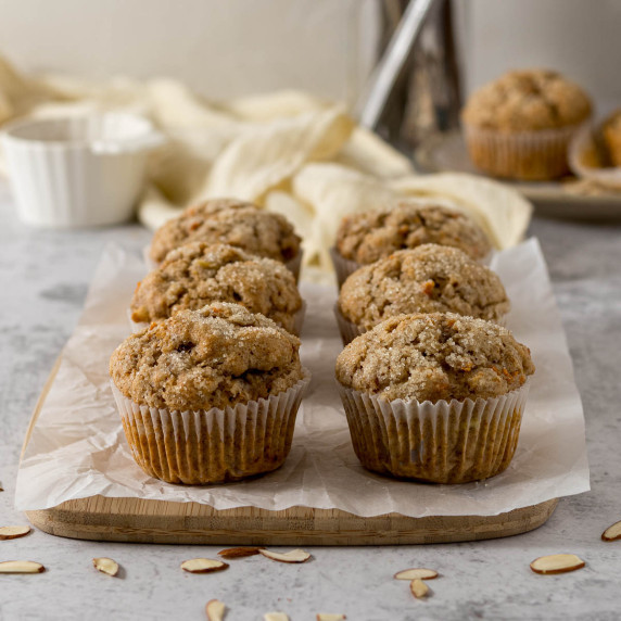 Banana carrot muffins on a serving board.