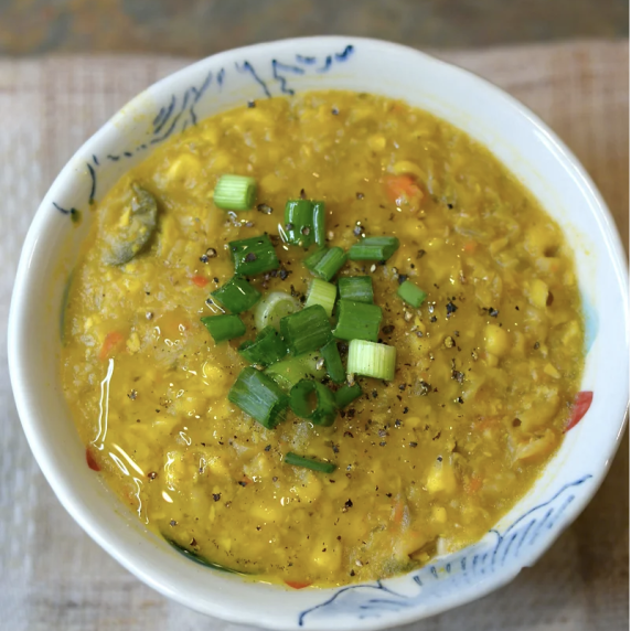 corn chowder in a white bowl. 