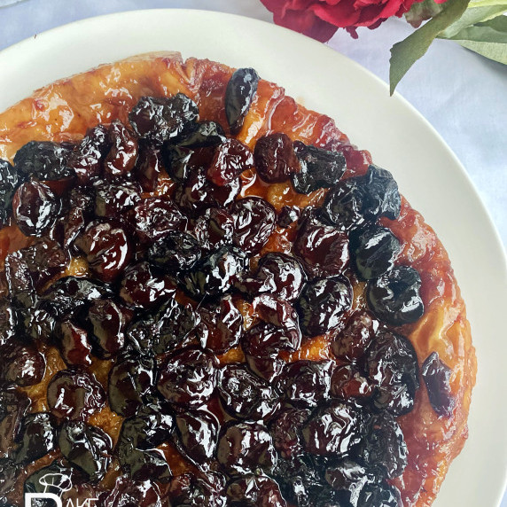 Puff pastry with cherries on top, caramelized in a mixture of sugar and butter.